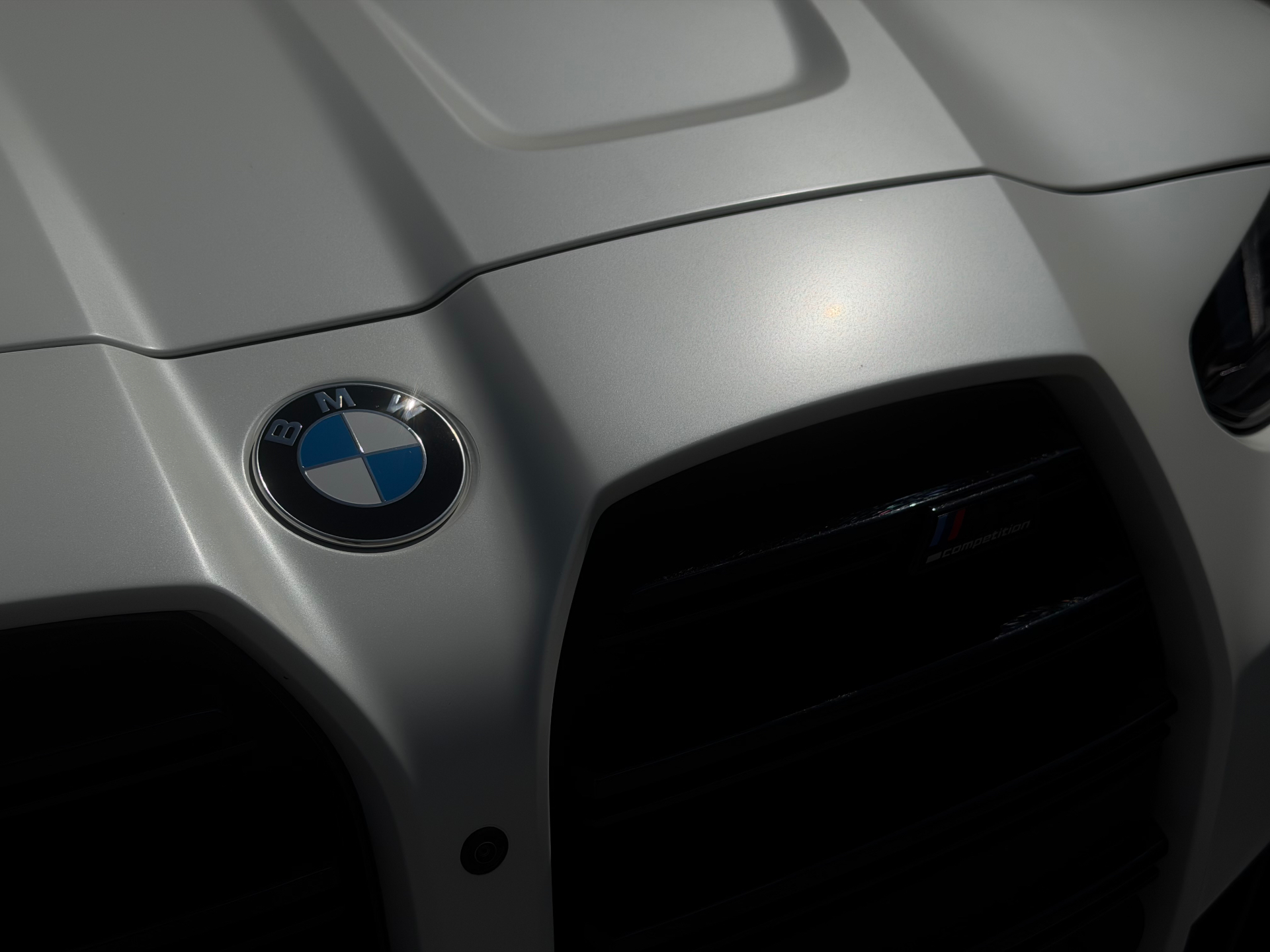 White BMW M competition front end